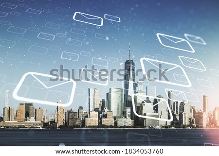 Abstract virtual postal envelopes hologram on New York cityscape background, email and notification concept. Multiexposure
