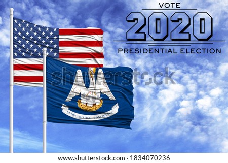 US elections in November 2020, against a blue sky, two flagpoles with the flag of America and the State of Louisiana.