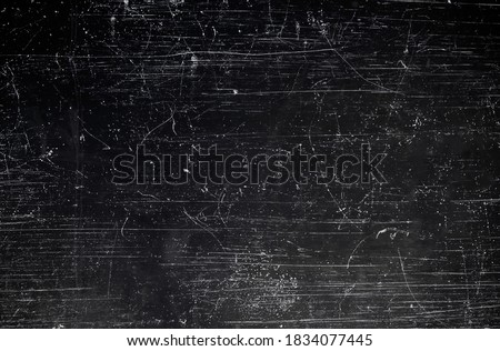 Black scraped metal sheet, grunge background or texture  Royalty-Free Stock Photo #1834077445