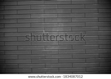 Black brick wall. Urban black brick wall texture masonry background.