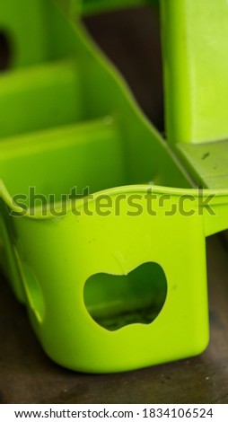 a green plastic cup drink holder