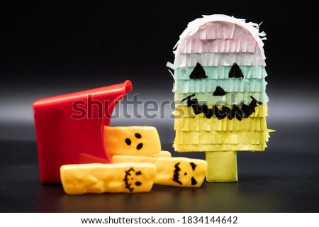 halloween background. food party. fries with faces. funny halloween party, movie concept. dark background