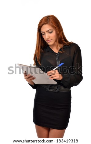 Portrait of a young Arab business woman doing some paperwork, isolated over white background