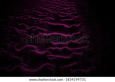 Pink colored shaded sands of the desert. Background and texture for modern design