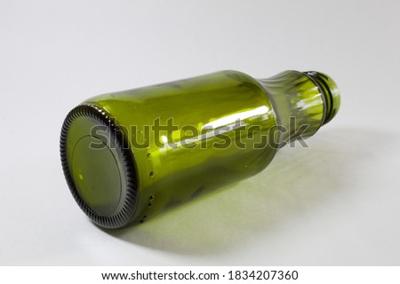 Green glass bottle with white background