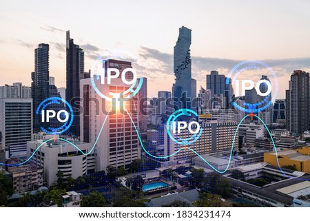 Hologram of IPO glowing icon, sunset panoramic city view of Bangkok. The financial hub for transnational companies in Asia. The concept of boosting the growth by IPO process. Double exposure.