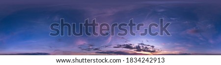 Seamless dark blue and pink sky before sunset hdri panorama 360 degrees angle view with beautiful clouds for use in 3d graphics or game development as sky dome or edit drone shot
