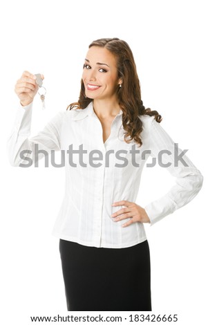 Young happy smiling business woman or real estate agent showing keys from new house, isolated over white background