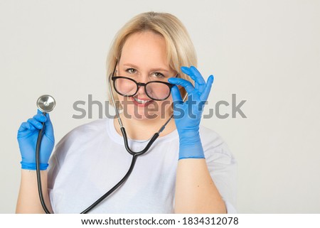 beautiful young plump female in white t-shirt with stethoscope