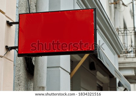 Rectangular sign on the building. Copy space and space for text. Mockup for design. Blank template for advertising.