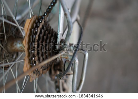 Rusty chain , gear speed and  sprockets of bicycle. Need oil to 
lubricate it. Concept for treatment of the bicycle's drive system.