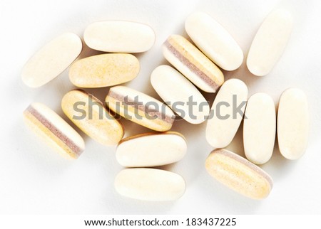 Probiotic pills on white background Royalty-Free Stock Photo #183437225