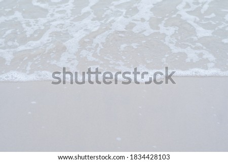 Sand on beach with little wave