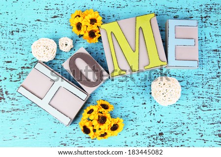 Composition with decorative letters on wooden background
