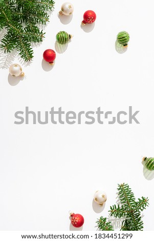 Christmas composition. Christmas red and green decorations on white background. Flat lay, top view, copy space