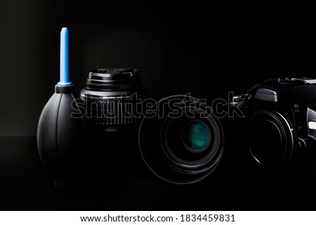 Collection of camera photographer lens on black background