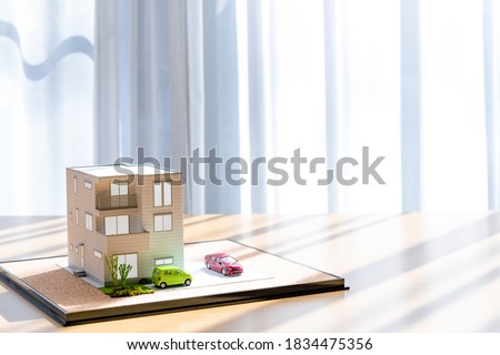 3D model of a house on a table (real estate image) Royalty-Free Stock Photo #1834475356