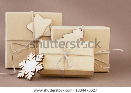 Ecological gifts in three boxes on the brown background 