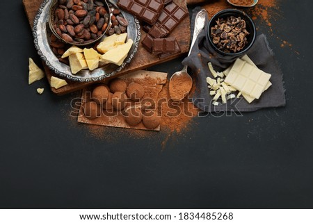 Delicious chocolate bars and pieces. Top view, copy space