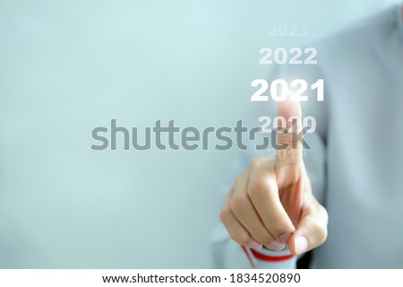 Businessman pointing business calendar happy new year 2021 - Business concept. Royalty-Free Stock Photo #1834520890