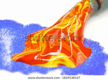 close-up colorful paint splashes with brush background
