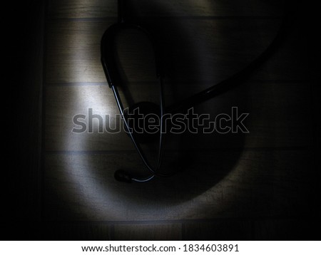 Picture of light streaks around a stethoscope shot at night. Long Exposure photography.