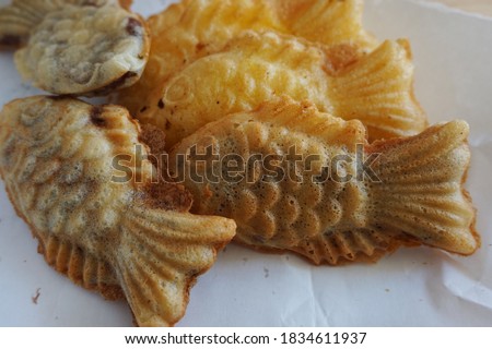 Korean winter street food. fish bread (bung-eoppang). Fish-shaped bread with sweet red bean filling in South Korea. Royalty-Free Stock Photo #1834611937