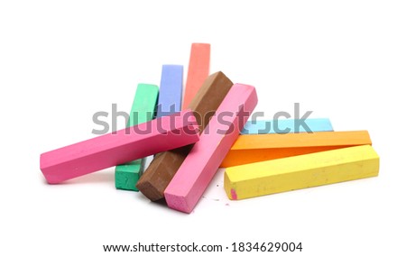Colorful cosmetic hair dye chalk pile isolated on white background