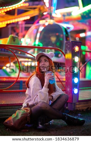 Pretty young woman in amusement park