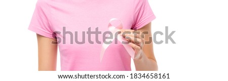 Horizontal image of woman holding pink ribbon isolated on white, concept of breast cancer