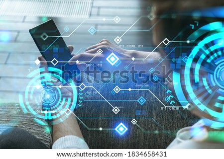A man in casual wears, using smart phone. Double exposure. Tech theme hologram.