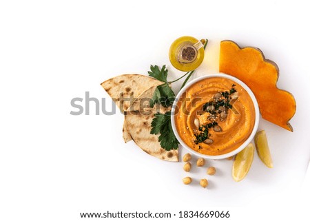 Pumpkin hummus and ingredients isolated on white background. Top view.Copy space