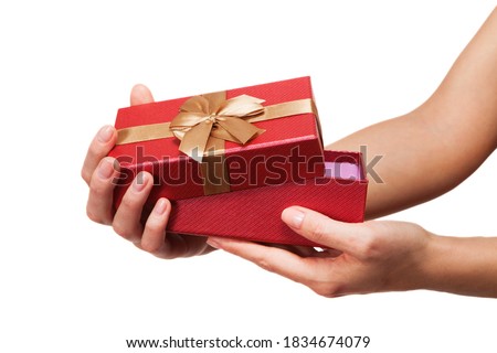 Hands holding beautiful gift box, female giving gift.
