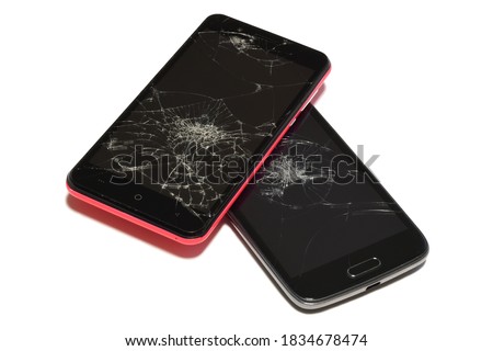 smartphone with broken and cracked screen isolated on white background