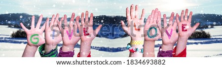 Children Hands Building Word Give Love, Snowy Winter Background