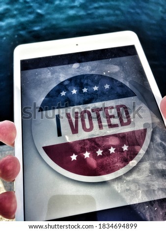 İllustrated photo of i voted today picture , man holding digital tablet