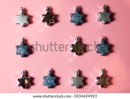 pink background christmas decorations flay lay