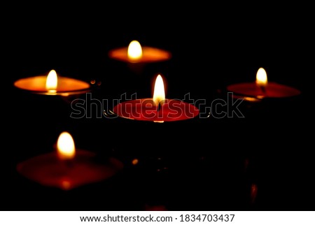candles arranged for meditation in the dark room