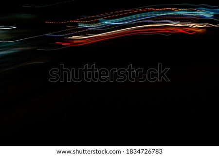 Abstract night lights background,Colorful lights of urban city surrounding moving and blurred by motion