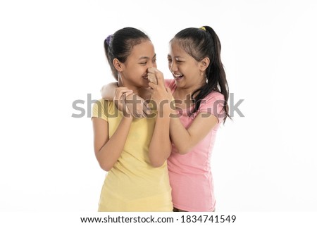 portrait happy from two young girl isolated in white background