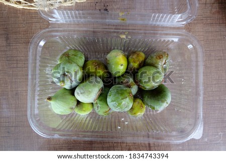 Spoiled green figs. Rotten ripe fig. Worms in a fruits. Black and white mold . Fungi. Unhealthy food. It is called "Bozuk Incir" or "Curuk Incir" in Turkish.
