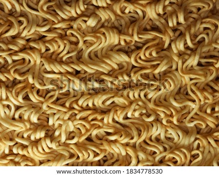 Full frame yellow Instant noodles for background.
