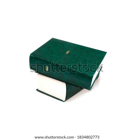 Stack of books in green covers with white sheets isolated on a white background