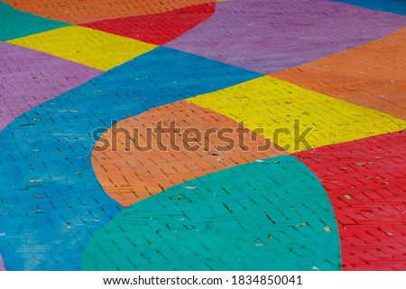 Colourful bricks footpath, Multicolor painted on outdoor path, Rainbow coloured on street, Symbol of gay, Lesbian, Bisexual and transgender, LGBT social movements, Abstract background. Royalty-Free Stock Photo #1834850041