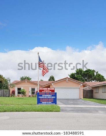 American Flag pole Real Estate For Sale Open House Welcome Sign Suburban Ranch Back split style home residential neighborhood USA Blue Sky Clouds
