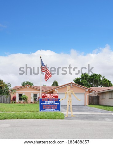 American Flag Mannequin next to Real Estate For Sale Open House Welcome Sign Suburban Ranch Back split style home residential neighborhood USA Blue Sky Clouds