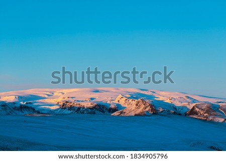Iceland's incredible mountain landscape in winter. Mountains in the snow. Large spaces. The beauty of winter nature.
