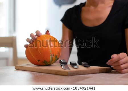 the process of making a Halloween pumpkin. horror theme and Hallowe'en.