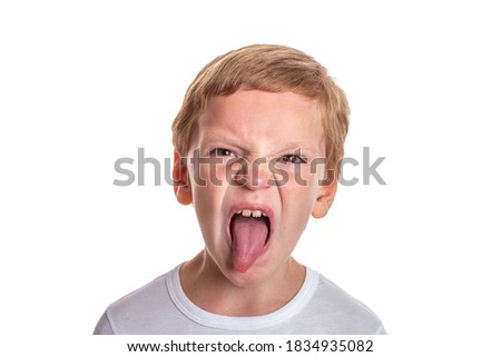 Speech therapy concept. Little boy doing exercises for correct pronunciation. Isolation on a white background. High quality photo