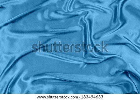 Blue wavy silk fabric background